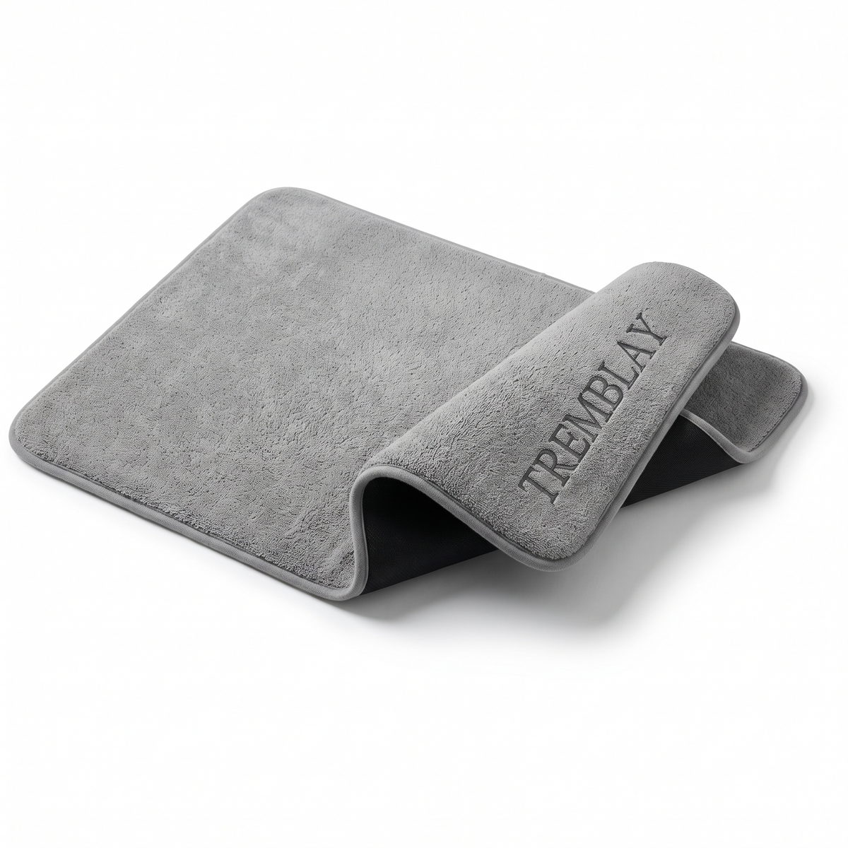 Tapis de bain à mémoire de forme gris, nom brodé, dessous en latex